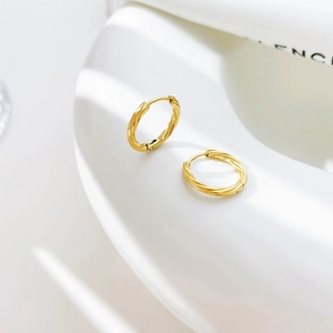 Elegant gold twisted rope hoop earrings with spiral texture for a chic minimalist look