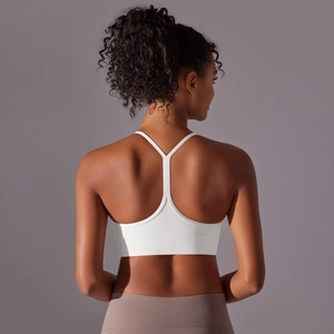 Detailed back view of white Y-back sports bra with slim straps and soft brushed fabric