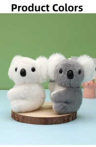 Detail of plush koala dolls in white and grey colors on a natural wood base stand