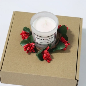 Mini Christmas berry wreath with handmade aromatherapy candle in a frosted glass jar