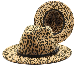 Detailed view of leopard print fedora hats with black buckled bands and inner lining