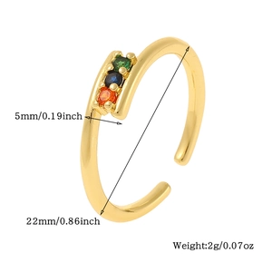 Detail view of gold open ring with green, blue, and orange stones showing size 5mm and 22mm