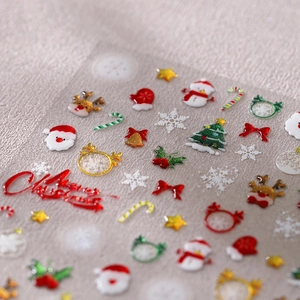 5D geprägte Weihnachts-Nagelsticker mit Weihnachtsmann, Rentier und Goldflocken