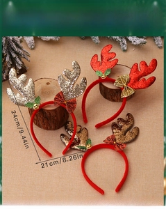 Detail of Christmas reindeer antler headbands with sequins, bows, and bells for holiday party
