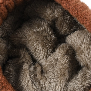 Close-up of thick fleece lining and brown knit texture of this warm winter hat