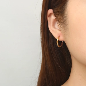 Two-tone twisted texture hoop earrings in gold and silver finish for men and women