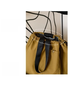 Detail of the drawstring opening and secure snap pocket on the thermal insulated lunch bag