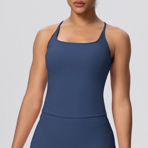 Detailed close-up of dark blue yoga camisole with thin straps and matte fabric texture