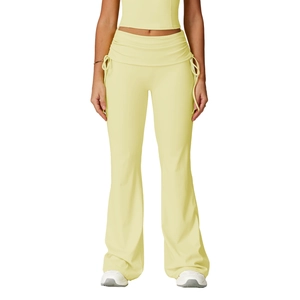 Pale yellow high-waisted flare yoga pants with ruched waistband and side drawstring detail