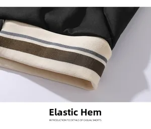 Close-up detail of the elastic ribbed hem with striped pattern on casual shorts