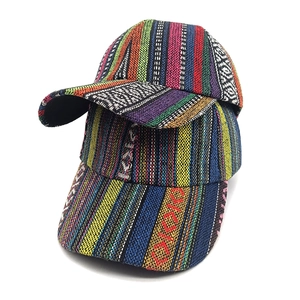 Bohemian style woven baseball cap with colorful ethnic stripes on white background
