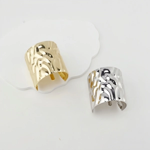 Minimalist wide metal open cuff bracelet with irregular textured hammered finish in gold and silver