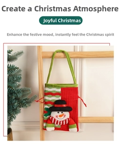 Detail of Christmas gift bag with 3D snowman character and green braided handle
