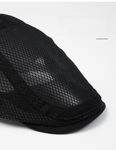 Close-up of black breathable mesh fabric and reinforced wide brim on this flat cap