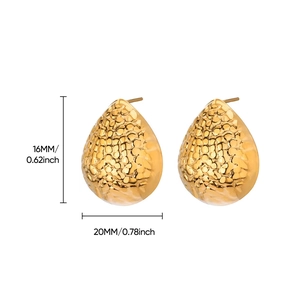 Detailed size view of irregular gold water drop stud earrings with hammered texture
