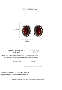 Detailed view of red zircon earrings showing height 2.4cm and width 1.8cm on white background