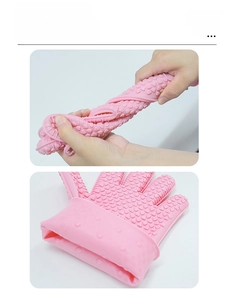 Detailed view of pink silicone oven glove showing anti-slip texture and high flexibility