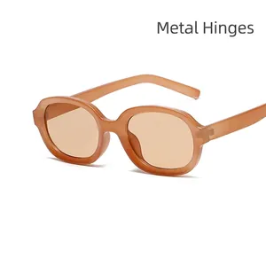 Retro oval amber resin sunglasses with durable metal hinges and light brown lenses