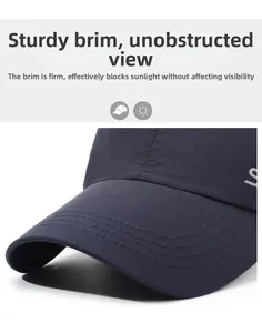 Macro detail of navy baseball cap brim showing stitched layers and decorative S logo