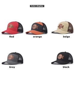 Detail view of five mesh trucker hats with leather fishing patches in various colors