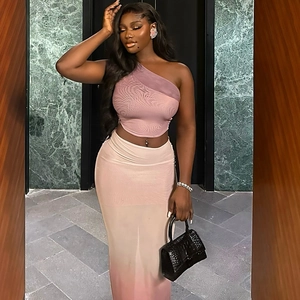 Detail of pink one-shoulder mesh top and gradient maxi skirt set on model