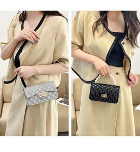 Quilted jelly crossbody bags in grey and black with pearl handles and gold chain straps