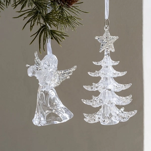Set of clear acrylic Christmas tree and angel ornaments with silver glitter on pine branch