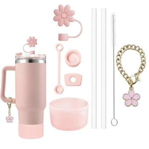 Pink Stanley cup accessory set with flower straw covers, silicone base and charm chain