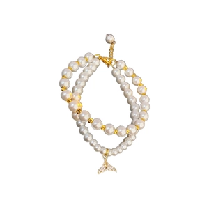 Double-layer pearl bracelet with gold-plated fishtail pendant and zircon accents