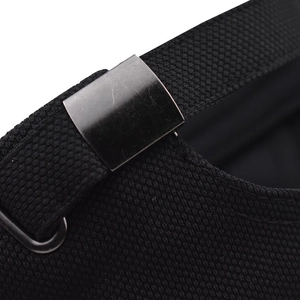 Close-up of the adjustable metal buckle and mesh fabric strap on the black baseball cap