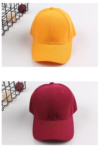 Detail view of cotton baseball caps in ginger and burgundy with six-panel structure