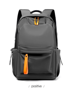 Front view of grey waterproof oxford backpack with vibrant orange zipper details