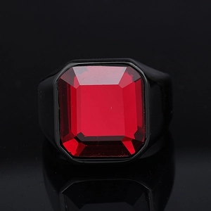 Macro shot of large rectangular red gemstone ring with polished black electroplated band