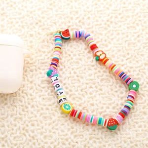 Colorful fruit and LOVE letter beaded phone strap on cream knit texture surface