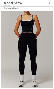 Détail d'un ensemble de yoga taille haute noir premium avec coutures blanches contrastées