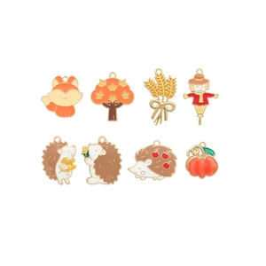 Detailed set of eight autumn-themed enamel charms including fox, hedgehog, and pumpkin shapes