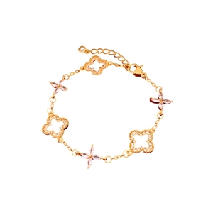 24K gold plated bracelet with hollow clover and pink crystal flower charms on white background