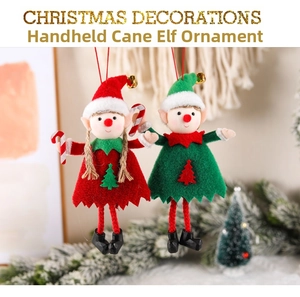 Detail of red and green Christmas elf dolls with candy canes and golden bells