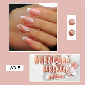 Detail view of pink almond press-on nails with white French tips and gold glitter lines