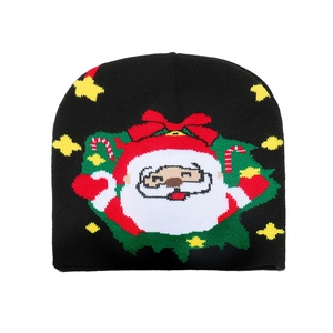 Festive black knit beanie featuring cartoon Santa Claus and Christmas patterns