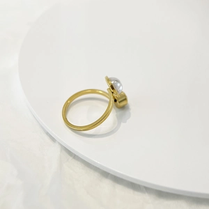 Minimalist open gold ring with white pearl and geometric bar, elegant women's jewelry