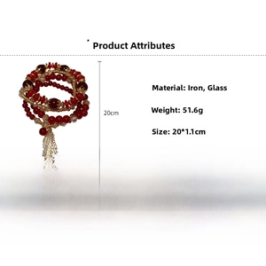 Detail view showing red glass beads and golden carved alloy charms of the 4-piece bracelet set
