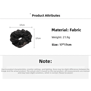 Detailed size specifications of a black polka dot fabric scrunchie with lace edges