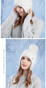Detail view of winter white knitted hat with ear protection and fluffy pompom accessory