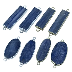 Detail of natural kyanite connectors with gold and silver plated edges for DIY jewelry