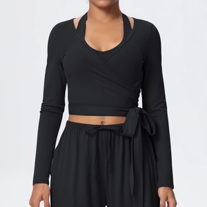 Detail of cross-front long sleeve yoga top with wrap-around ties and layered V-neck