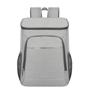 Gray insulated outdoor backpack with front zipper pocket and side mesh storage