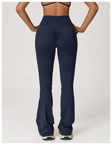 Rear view of high waist scrunch butt yoga flare pants in deep blue elastic fabric