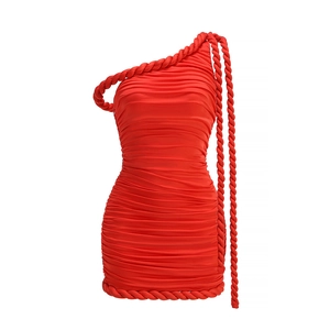 Detail of red one-shoulder party dress featuring textured rope trim and pleated fabric