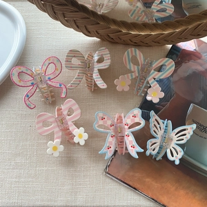 Set of 6 sweet bow and butterfly hair claws featuring floral prints and daisy accents